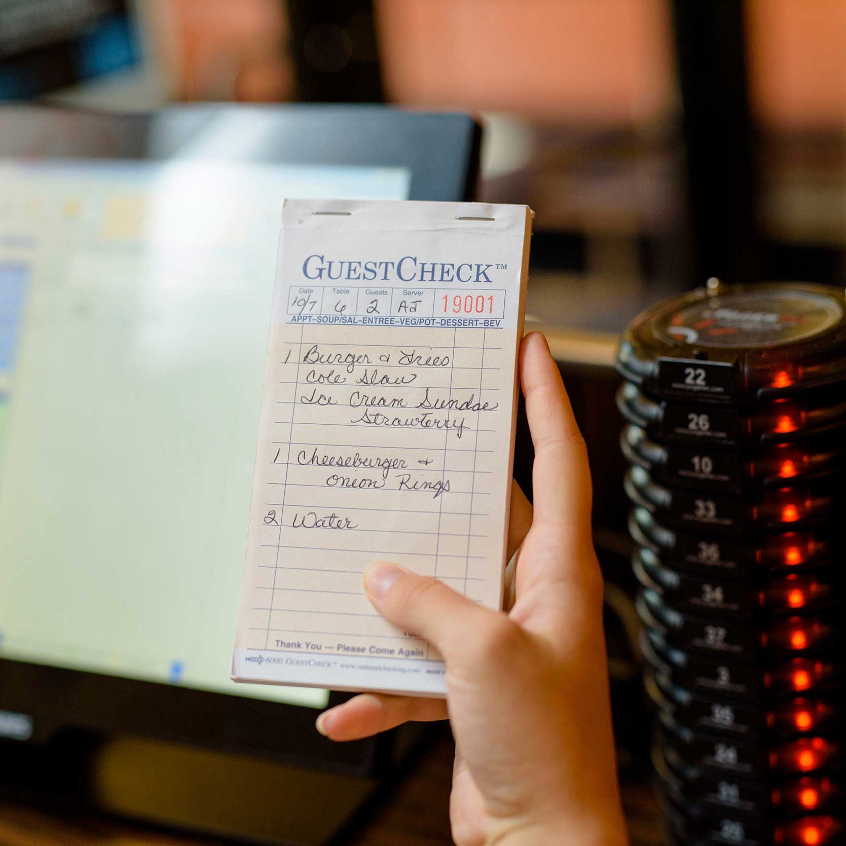 National Checking Company Interleaving Carbon Guest Check Paper - 2 Part Salmon, 17 Line, 3.5 x 6.75 inch -- 2500 per case.